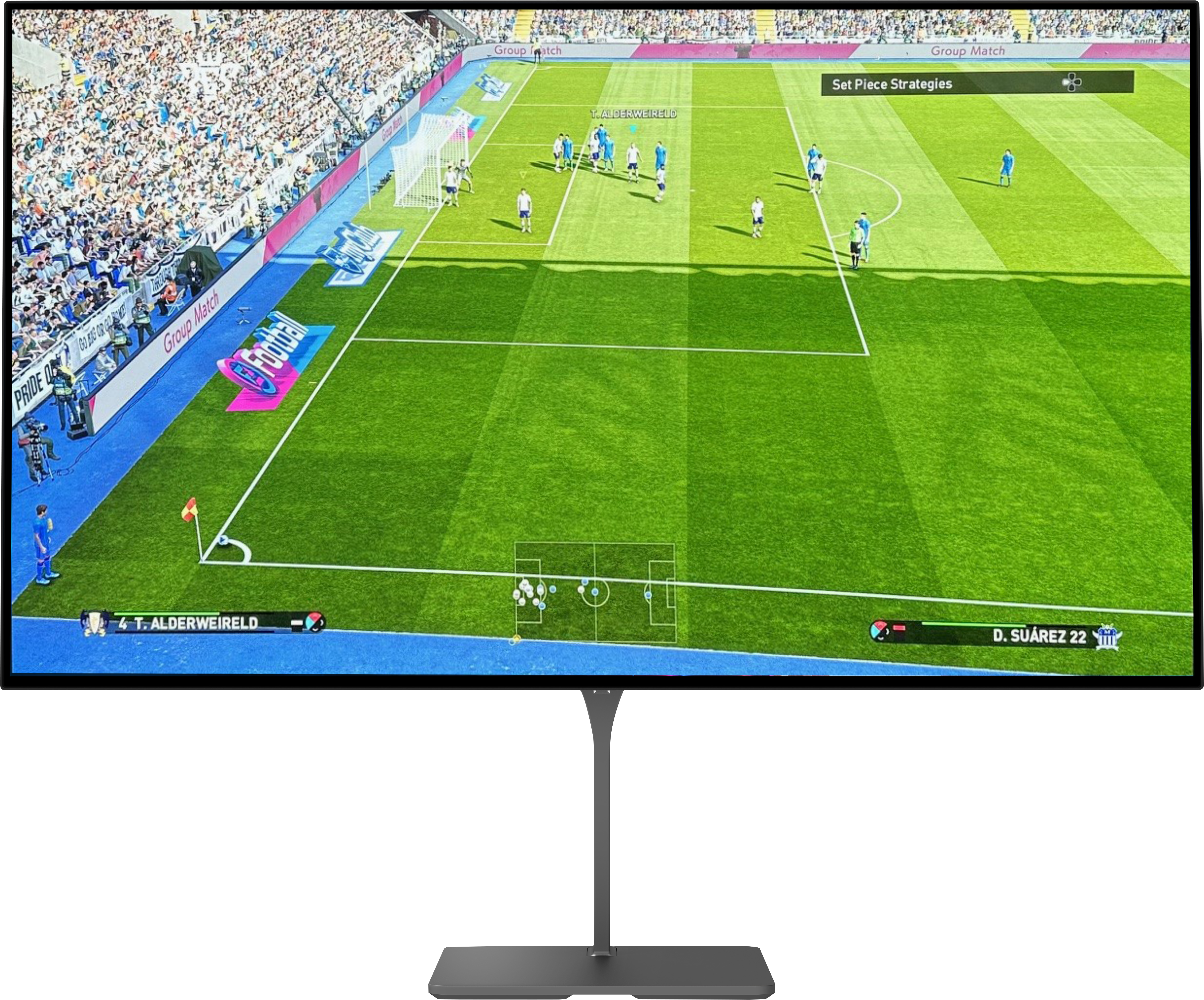 High-performance OLED gaming monitor showing a football video game