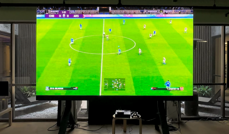 LED TV screen showing soccer video game