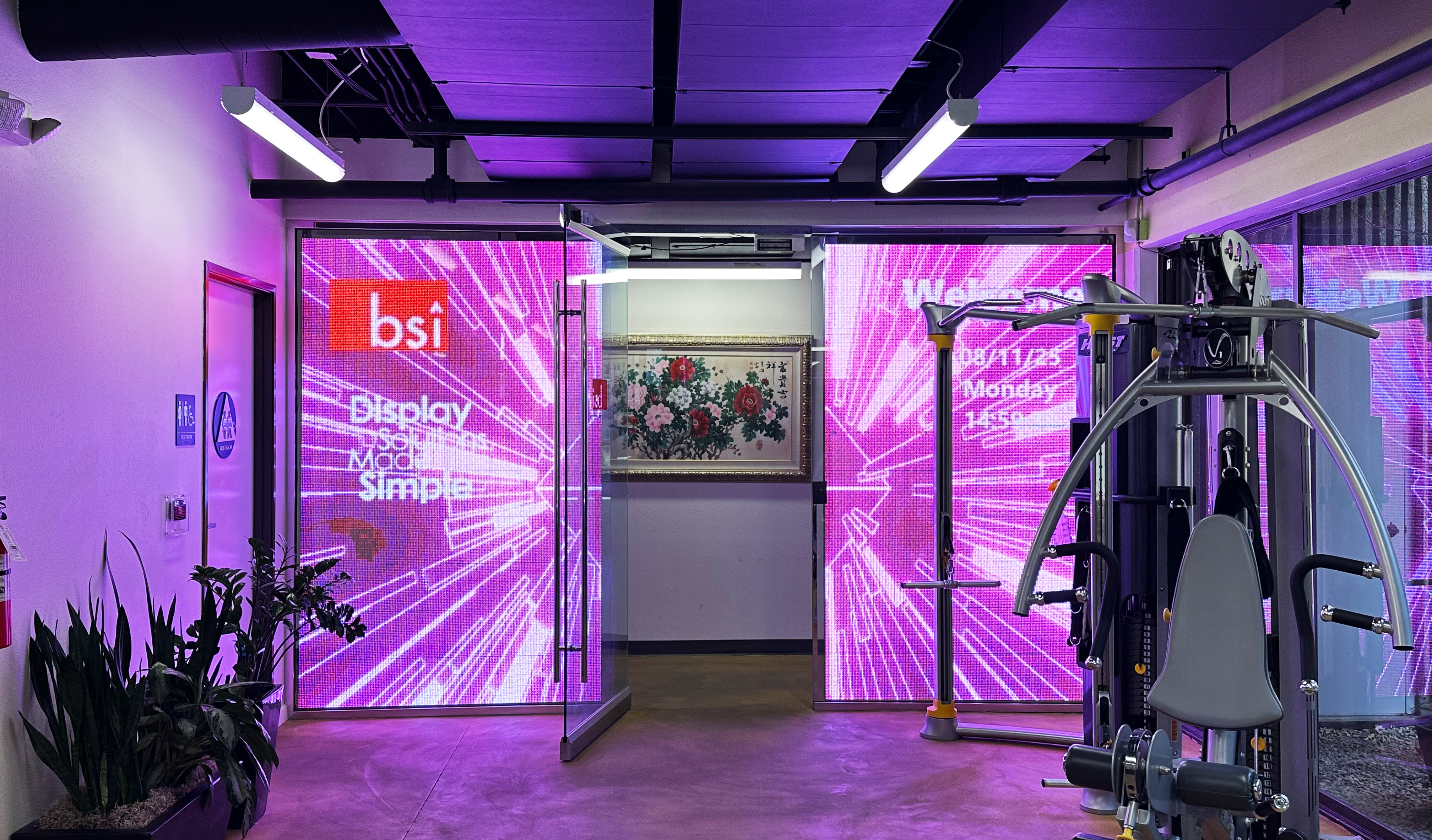 Colorful transparent LED screen featuring active background visuals and BSI logo.
