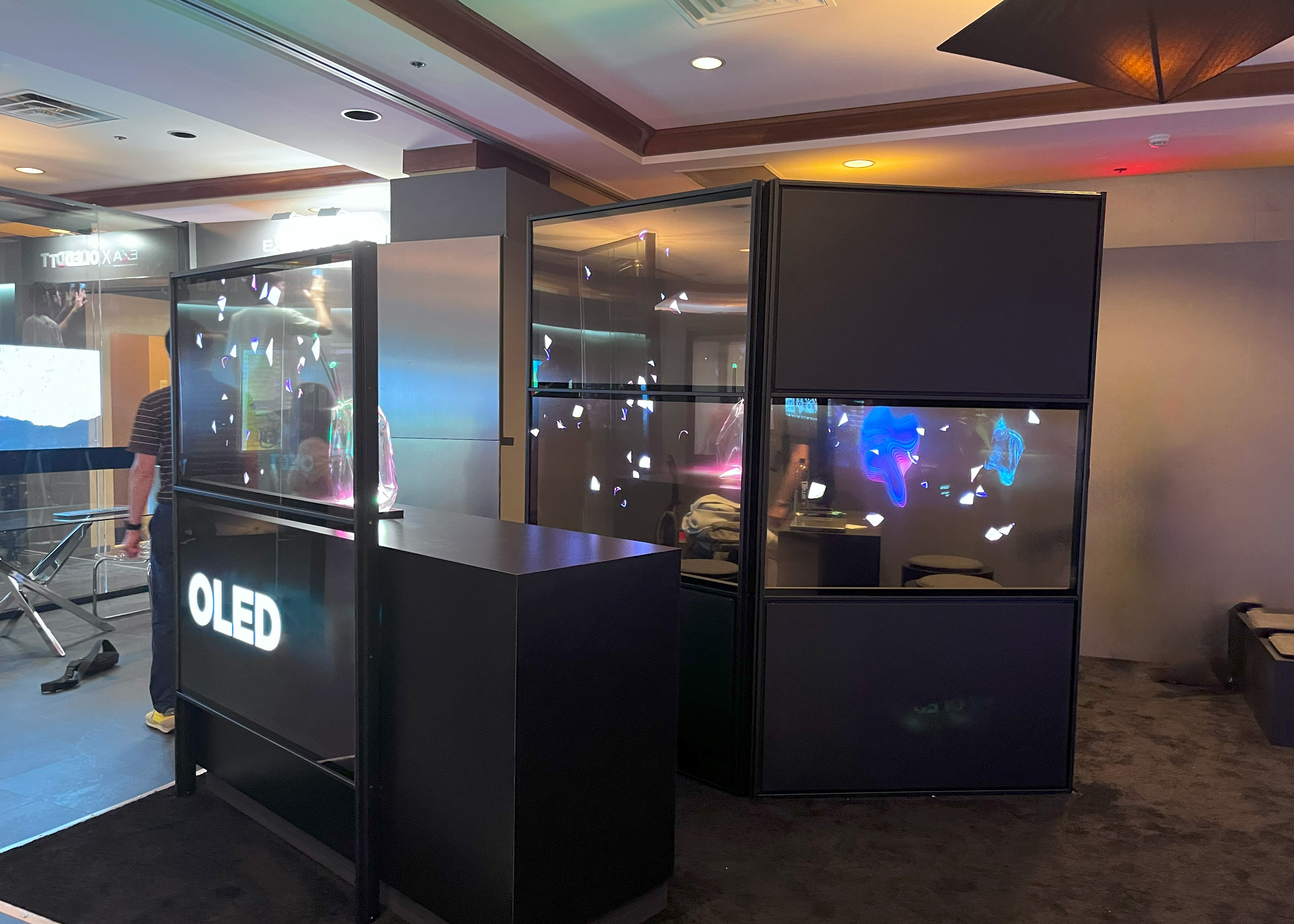 Transparent OLED screen on a table in an office