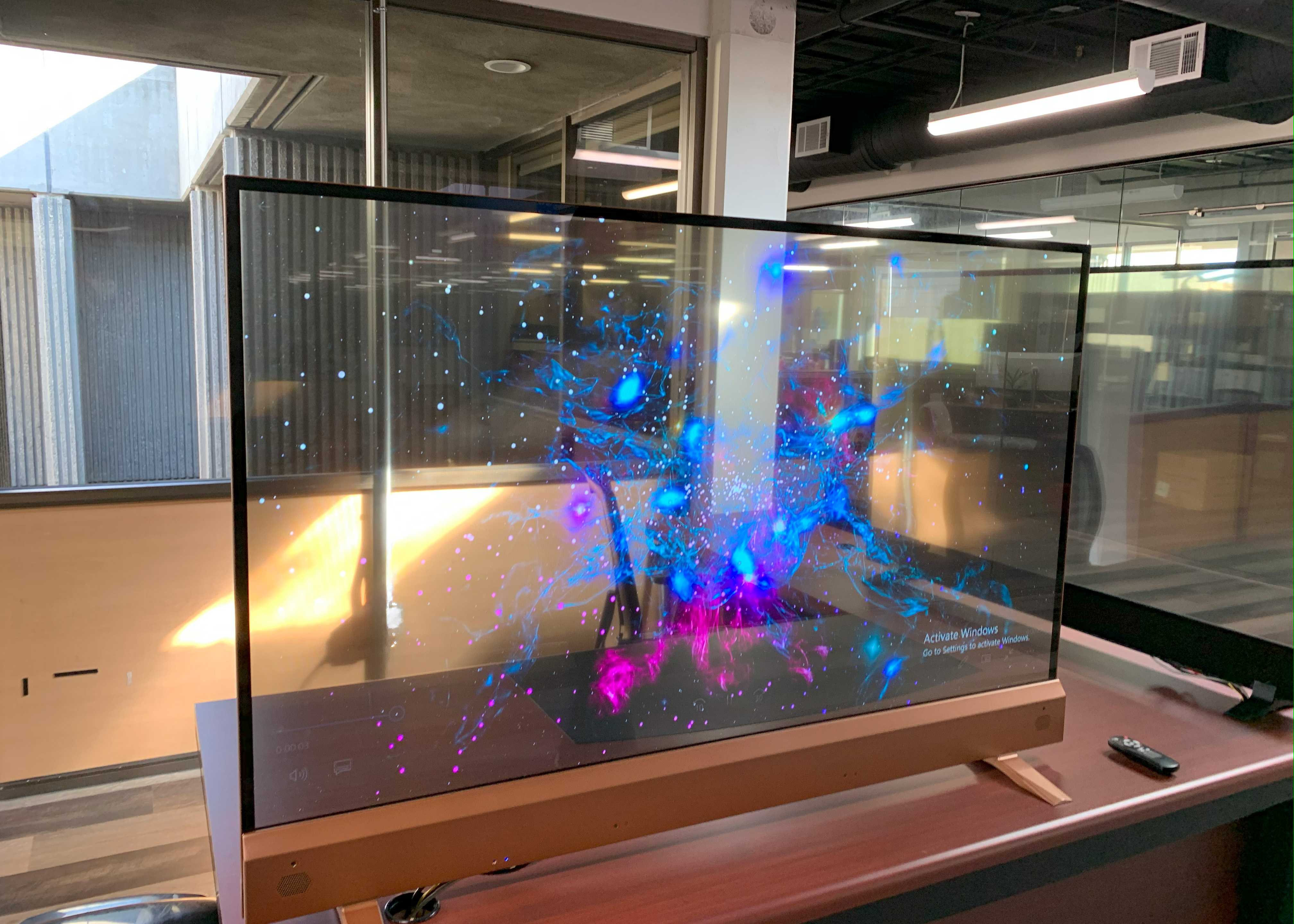 Transparent OLED mounted on a partition